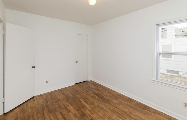 spare room with hardwood / wood-style flooring