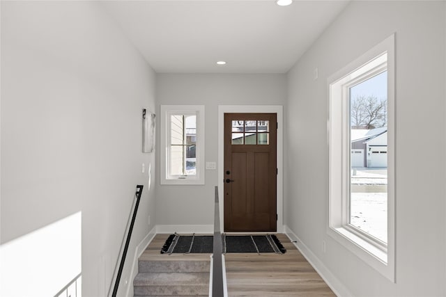 foyer entrance featuring plenty of natural light and light wood-type flooring