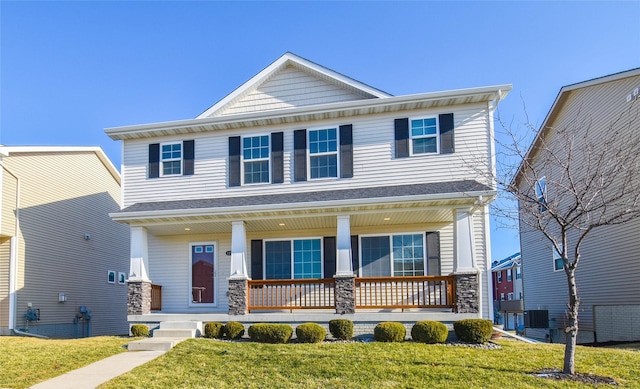 view of front of home with a porch and a front lawn