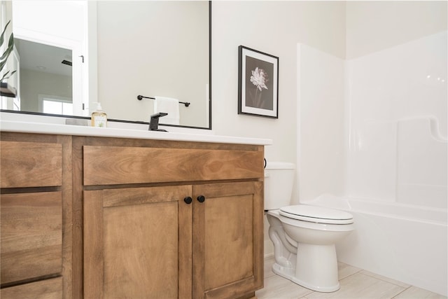 full bathroom with tile patterned floors, vanity,  shower combination, and toilet