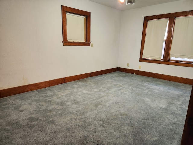 unfurnished room with carpet floors