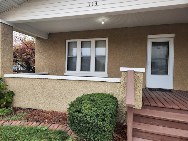 doorway to property with a wooden deck