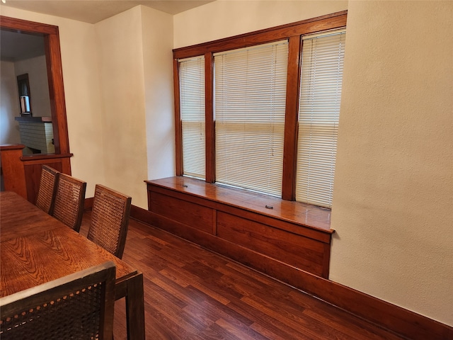 dining area featuring dark wood-type flooring