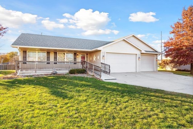 ranch-style home featuring covered porch, a garage, and a front yard