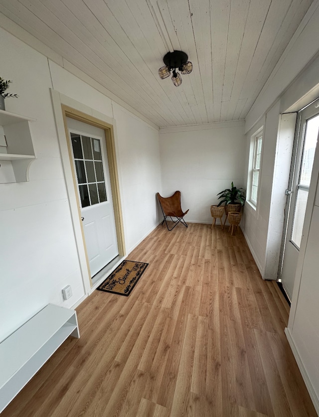 unfurnished sunroom with wooden ceiling