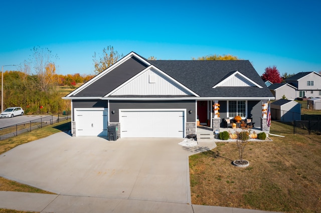 view of front of property with a garage and a front yard