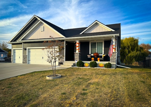 craftsman house with a garage, a porch, and a front yard