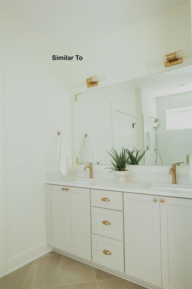 bathroom with tile patterned flooring and vanity