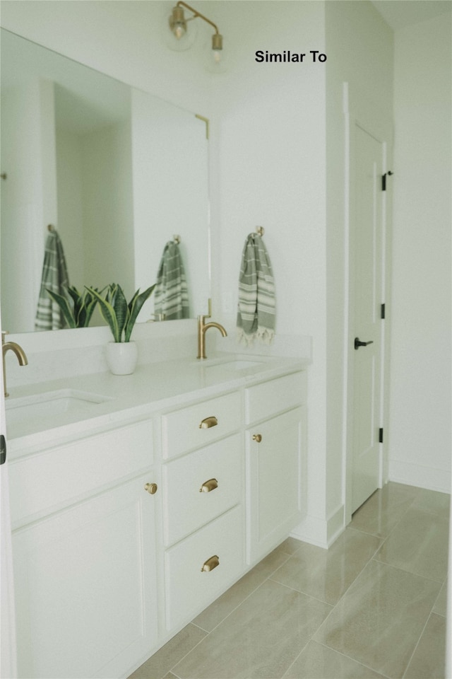 bathroom with vanity and tile patterned flooring