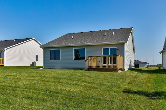 back of house featuring central AC unit, a yard, and a deck