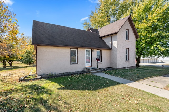 view of property with a front lawn