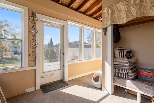 doorway featuring carpet floors