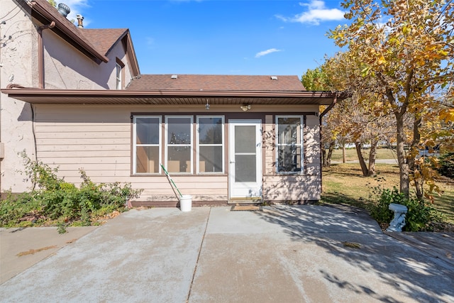 rear view of property featuring a patio