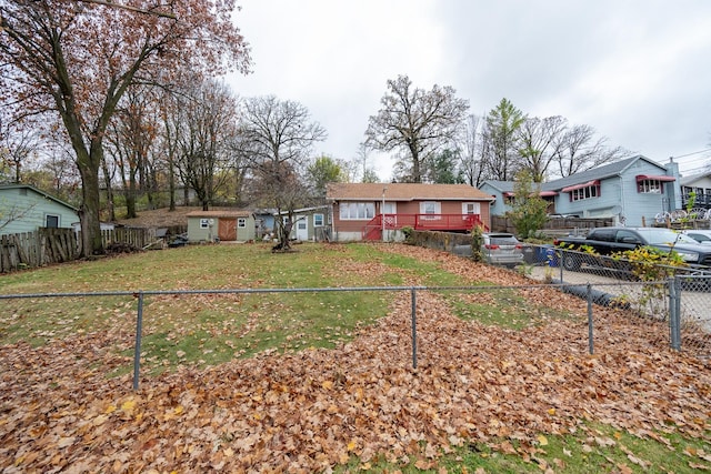 view of front of house with a residential view and fence