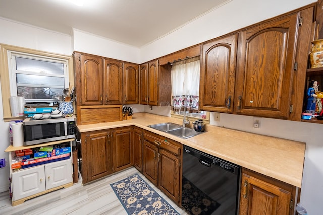 kitchen featuring a sink, light countertops, brown cabinets, dishwasher, and stainless steel microwave