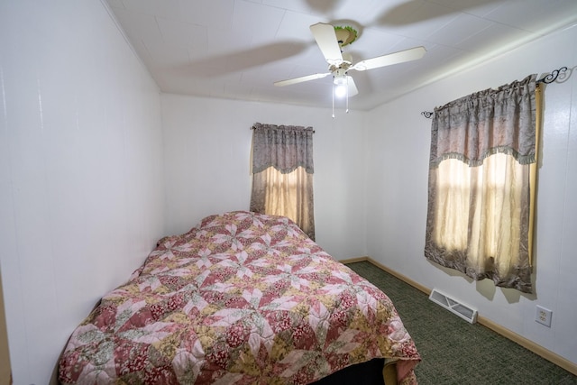 bedroom featuring baseboards, carpet, visible vents, and a ceiling fan