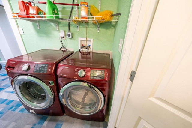 laundry room with laundry area and washing machine and clothes dryer