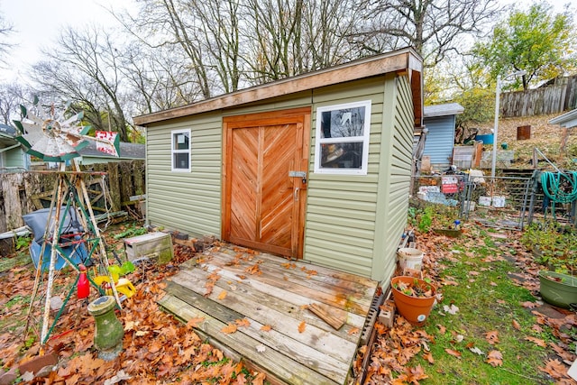 view of shed with a fenced backyard