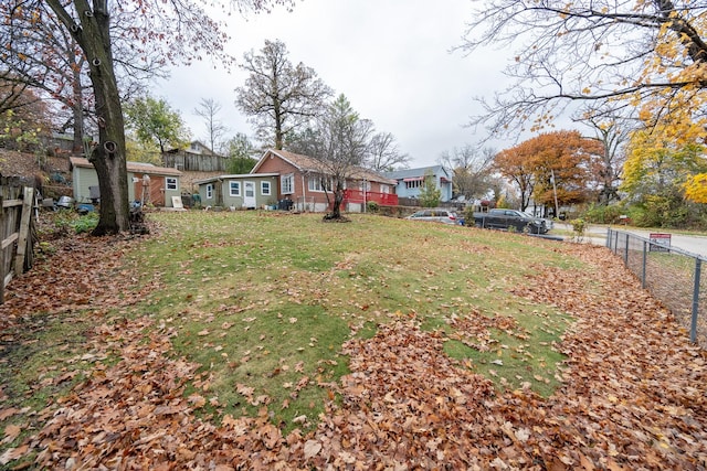 view of yard featuring a residential view and fence