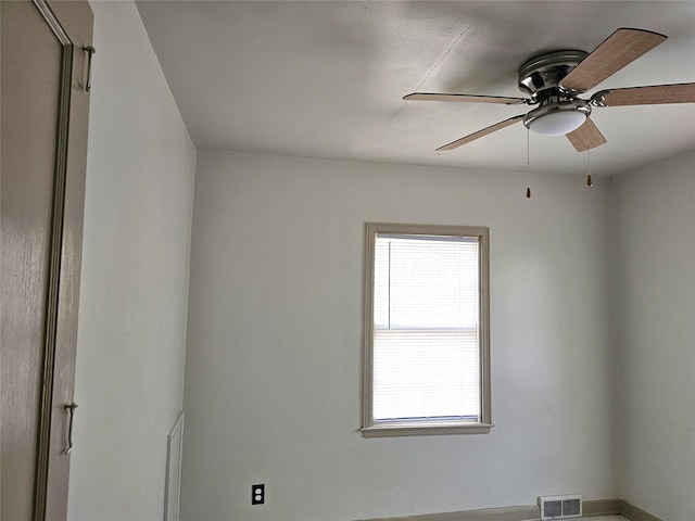 unfurnished room featuring a ceiling fan and visible vents