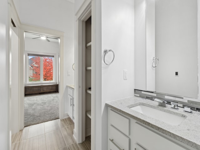 bathroom with tile patterned floors and vanity