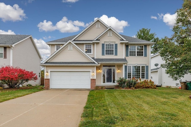 view of front of property with a front lawn and a garage