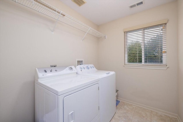 washroom featuring washing machine and clothes dryer