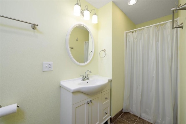 bathroom with a shower with curtain, tile patterned flooring, and vanity