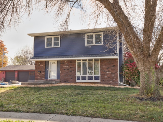 view of property with a garage and a front yard