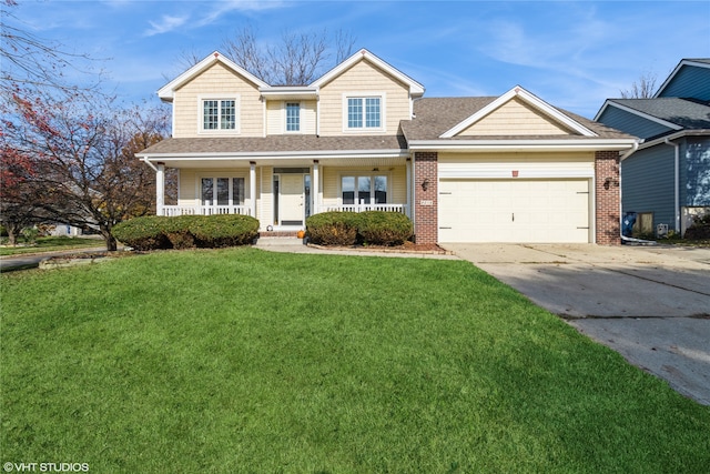 view of front of house with a front lawn, a garage, and covered porch