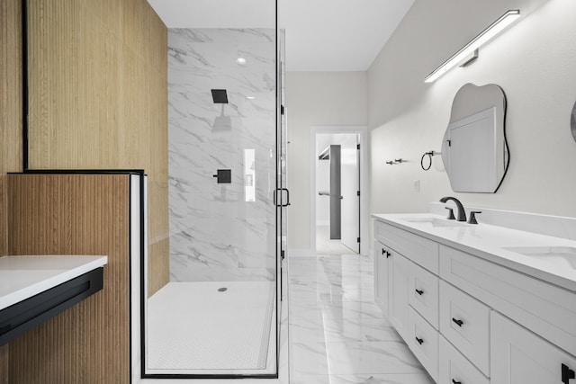 full bathroom with marble finish floor, a sink, a marble finish shower, and double vanity