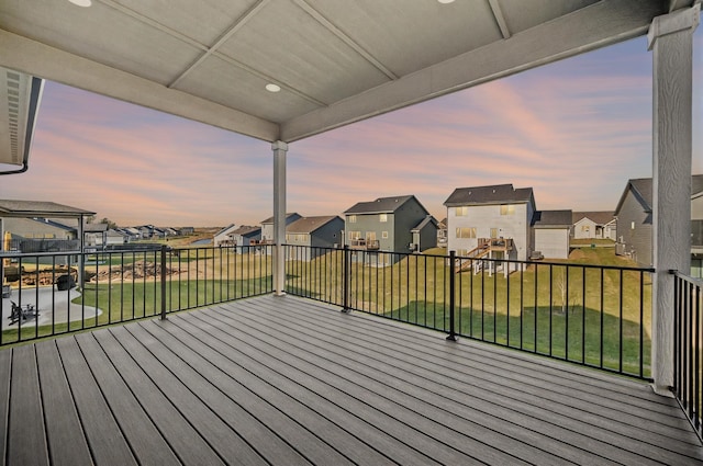 deck featuring a residential view and a yard