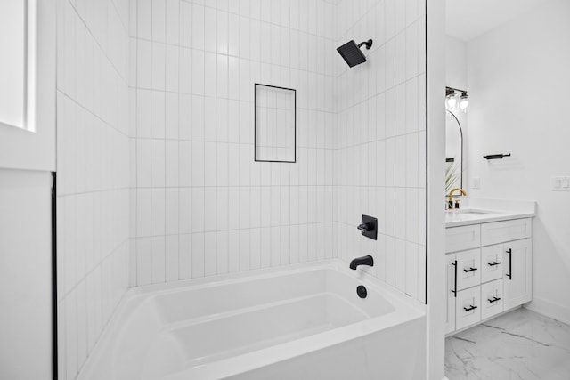 bathroom featuring vanity and tiled shower / bath combo