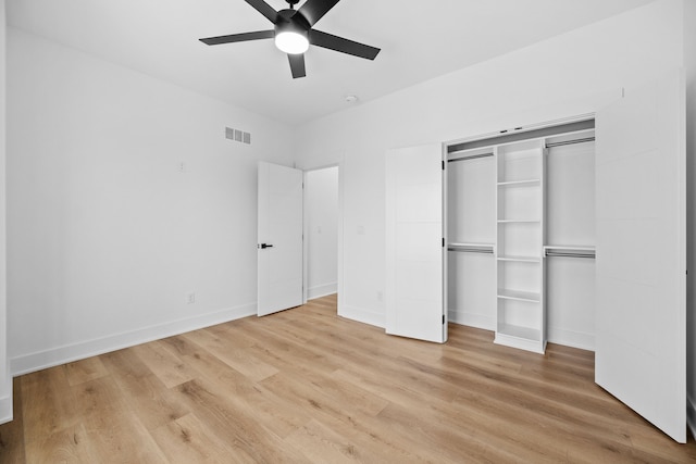 unfurnished bedroom featuring ceiling fan, a closet, and light hardwood / wood-style floors