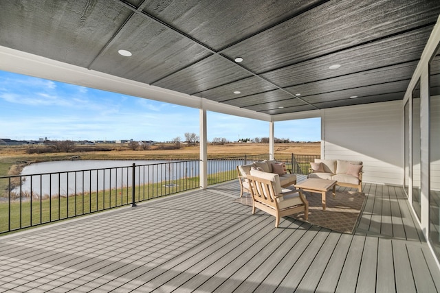 deck featuring an outdoor hangout area and a water view