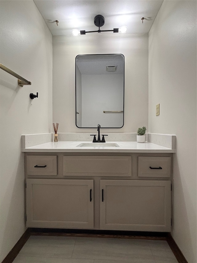 bathroom with vanity and tile patterned flooring