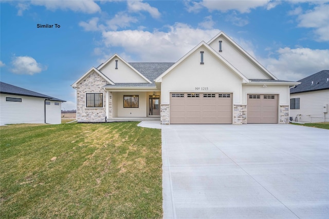 view of front of property with a garage and a front lawn