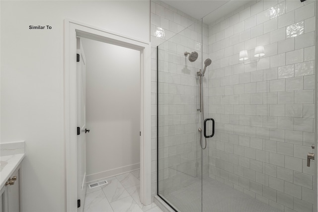 bathroom with vanity and a shower with door