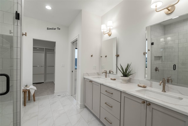 bathroom with vanity and an enclosed shower