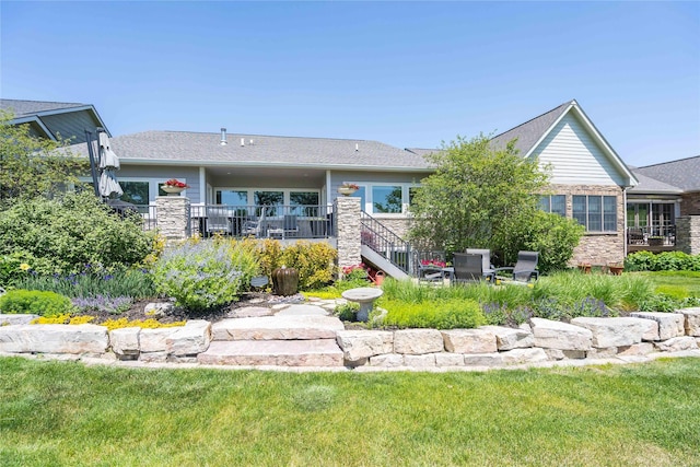 1902 Park Ave, Des Moines, IA 50315 - rear view of property with stone siding and a lawn