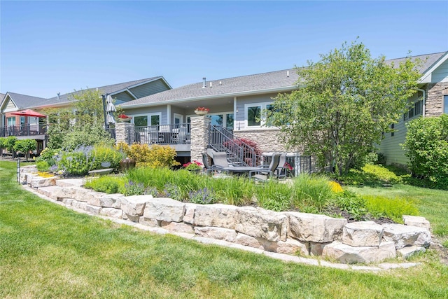 1902 Park Ave, Des Moines, IA 50315 - rear view of house featuring a deck and a yard