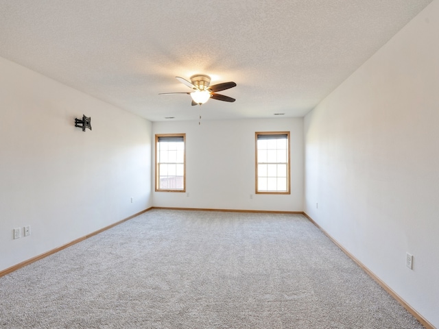 unfurnished room with carpet, a textured ceiling, and ceiling fan