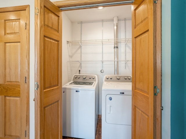 washroom with washing machine and dryer