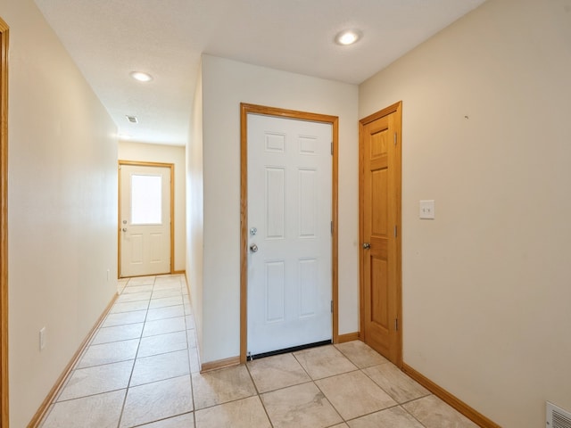 foyer with light tile patterned floors