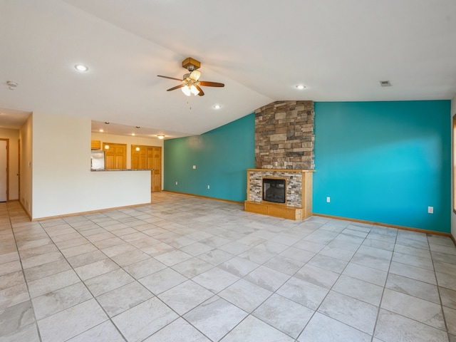 unfurnished living room featuring a stone fireplace, ceiling fan, vaulted ceiling, and light tile patterned flooring