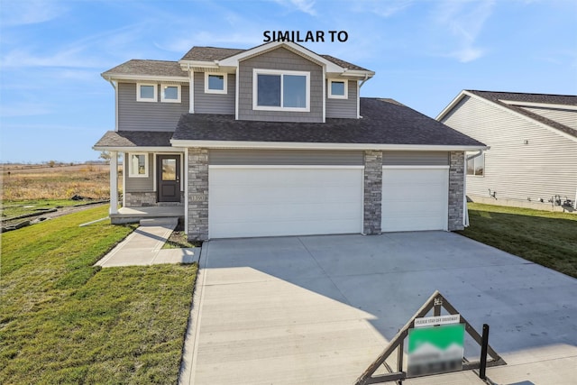 view of front of property with a garage and a front lawn