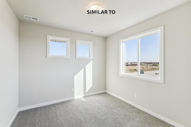 unfurnished room featuring carpet floors