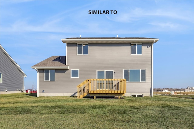 rear view of property featuring a lawn and a wooden deck