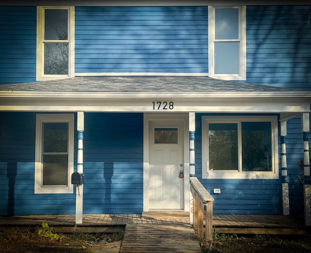 doorway to property with covered porch