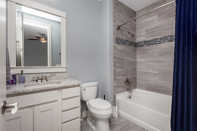 full bathroom featuring wood-type flooring, vanity, tiled shower / bath combo, toilet, and ceiling fan